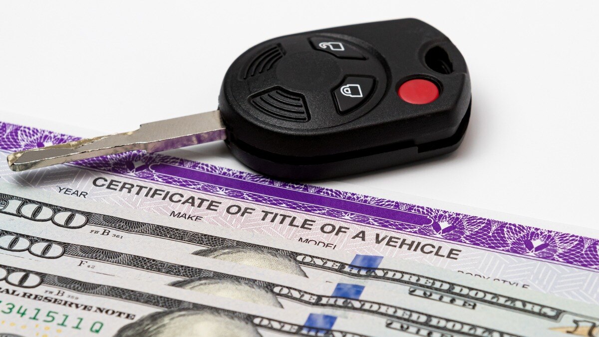 A car title, cash, and an ignition key.